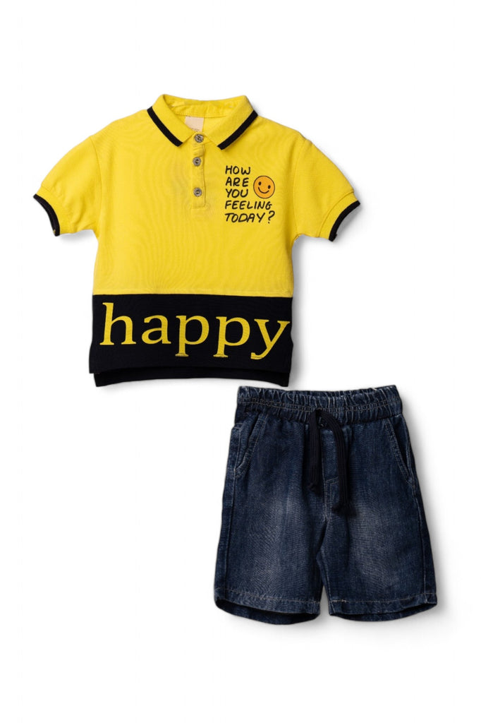 A stylish boy's casual outfit consisting of a yellow polo shirt with a black panel and "happy" text, paired with denim shorts.