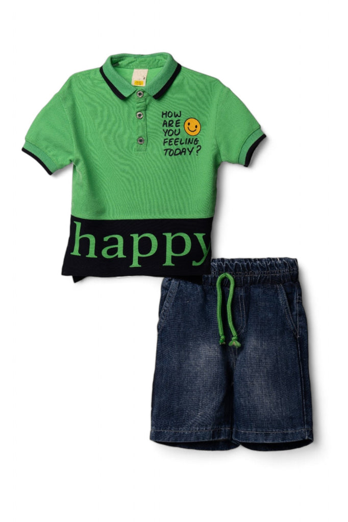 A stylish boy's casual outfit consisting of a green polo shirt with a black panel and "happy" text, paired with denim shorts.